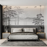 Black and white forest wallpaper in modern living room with gray sofa