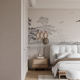 Minimalist bedroom featuring tree silhouette wall mural in monochrome tones