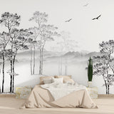 Home office with black and white forest mural creating depth