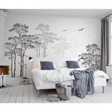 Minimalist entryway with forest silhouette wallpaper