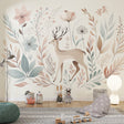 Forest deer wallpaper in a bright nursery with white furniture and soft pink accents