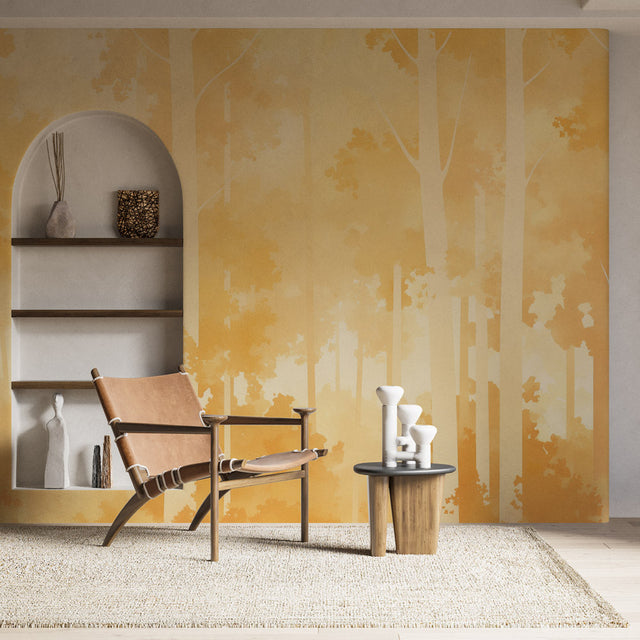 Golden forest wallpaper creating a warm glow in modern living room with minimal furniture