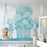 Enchanting blue tree mural with butterflies in a child's reading nook with cozy cushions