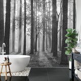 Forest wall mural in home office showing black and white misty trees