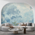 Misty forest wallpaper creating depth in a modern living room with soft morning light filtering through windows