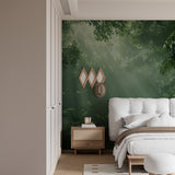 Green forest wallpaper adding depth to a cozy bedroom setting