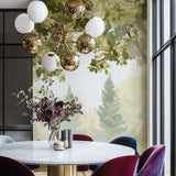 Misty forest wallpaper in cozy bedroom setting with morning light