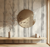 Grey forest wallpaper creating depth in modern living room with minimal furniture