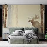 Forest Mural Wallpaper with moose silhouette creating depth in a modern living room with gray sofa