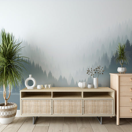 Misty forest wallpaper creating depth in a modern living room, pine trees emerging through gentle grey fog