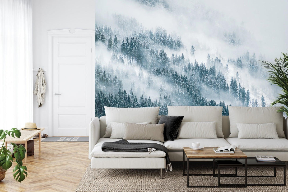 Misty pine tree wallpaper in cozy bedroom setting with wooden furniture