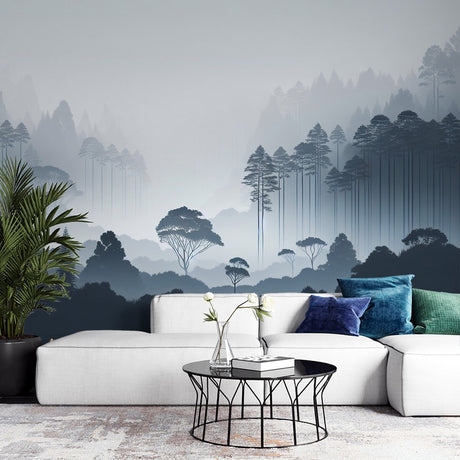 Misty forest wallpaper creating depth in a modern living room, pine trees emerging through morning fog