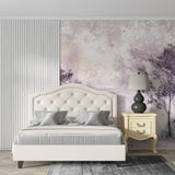 Purple forest wallpaper with gold accents creating depth in a modern living room with natural light