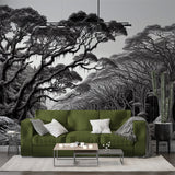 Monochrome forest wallpaper creating depth in a modern living room with high ceilings and minimal furniture