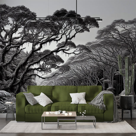 Monochrome forest wallpaper creating depth in a modern living room with high ceilings and minimal furniture