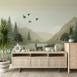 Forest wildlife wallpaper creating a cozy atmosphere in a modern living room with natural light and wooden furniture