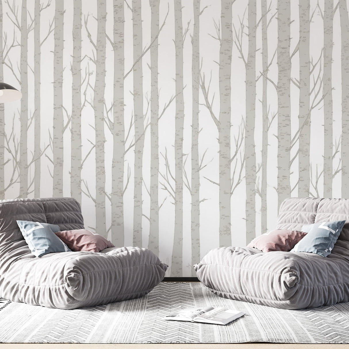 Birch tree wallpaper creating a serene atmosphere in a modern living room with natural light and minimal furniture