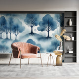 Blue forest wallpaper mural in modern living room, creating depth with watercolor tree design