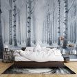 Winter forest wallpaper creating a cozy atmosphere in a modern living room, white birch trees adding depth to the space