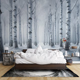 Winter forest wallpaper creating a cozy atmosphere in a modern living room, white birch trees adding depth to the space