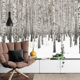Snowy birch tree mural adding depth to a minimalist bedroom with grey accents