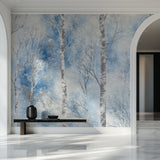 Winter birch tree wallpaper creating a peaceful atmosphere in a modern living room with white furniture