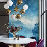 Mountain landscape wall mural creating an enchanting atmosphere in a reading nook
