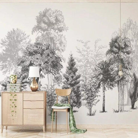 Black and white forest wallpaper creating depth in a modern living room with minimalist furniture
