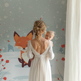 Baby room with fox garden wallpaper creating a sweet bedtime atmosphere
