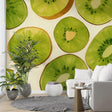 Fresh Kiwi Pattern Wallpaper displayed in a modern white kitchen, bringing vibrant green accents to the dining space