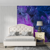 Abstract galaxy mural wallpaper featured in a teen's gaming room
