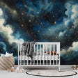 Galaxy constellation wallpaper creating a dreamy atmosphere in a cozy bedroom, with golden stars shimmering against deep blue walls