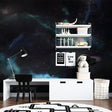 Galaxy wallpaper in modern bedroom creates dreamy atmosphere with soft nebula glow
