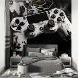 Black and white PlayStation controller wallpaper in a stylish gaming room with console setup
