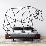 Geometric bear line art wallpaper displayed in a minimalist Scandinavian living room, showing clean black lines on white background