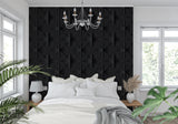 Dining room featuring black geometric wallpaper with dramatic lighting effects