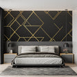 Geometric Art Deco wallpaper in modern living room showing black and gold pattern creating luxury atmosphere