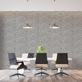 Modern geometric wallpaper in sleek living room showing black and white Art Deco pattern creating depth
