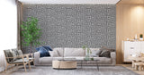 Art Deco geometric pattern wallpaper in dining room with dramatic contrast