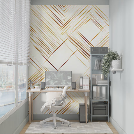 Gold geometric Art Deco wallpaper in modern living room with gray sofa and natural light