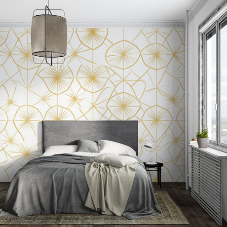Geometric gold sunburst wallpaper in modern living room with white sofa and natural light