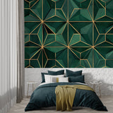 Art Deco inspired geometric pattern in emerald and gold adorning master bedroom wall