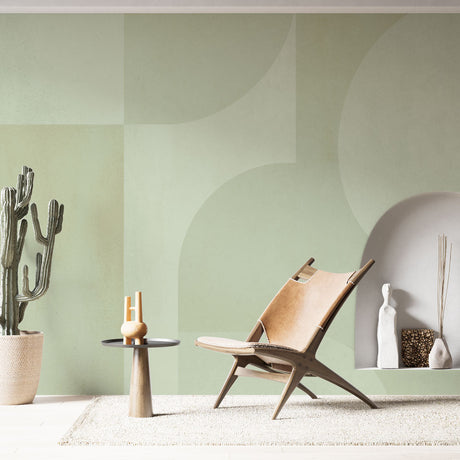Geometric sage green curved wallpaper in a modern living room creating a calm, sophisticated atmosphere