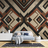 Geometric art deco wallpaper in terracotta and black creating drama in a modern dining room setting