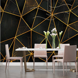 Black and gold geometric wallpaper in master bedroom adding sophistication