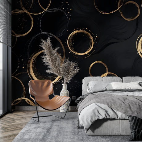 Black and gold geometric circle wallpaper creating drama in a modern living room setting
