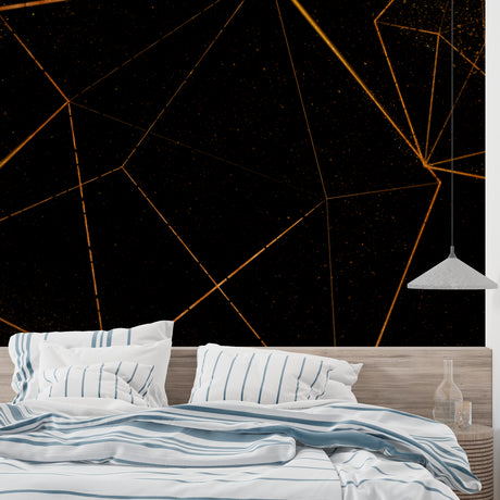 Modern geometric black and gold wallpaper in a minimalist living room setting with clean lines and contemporary furniture