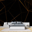 Geometric black and gold wallpaper in modern living room creating dramatic accent wall