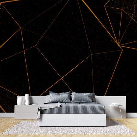 Geometric black and gold wallpaper in modern living room creating dramatic accent wall