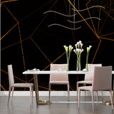 Modern office space featuring geometric linear wallpaper in black and gold